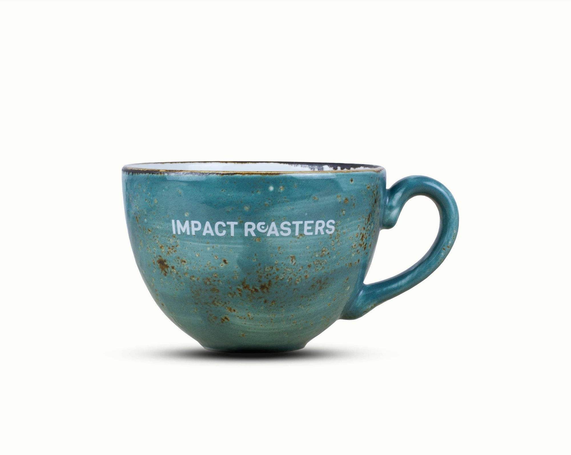 A ceramic cup with the Impact Roasters logo